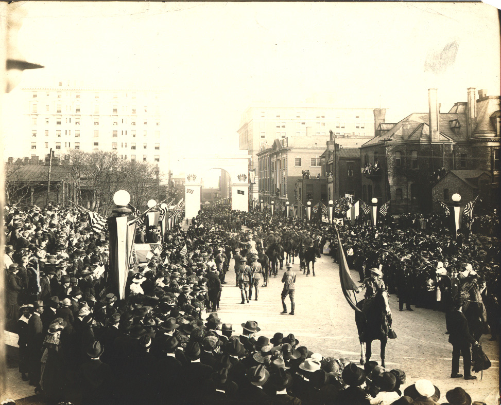 Troops marching through the World War I Victory Arch